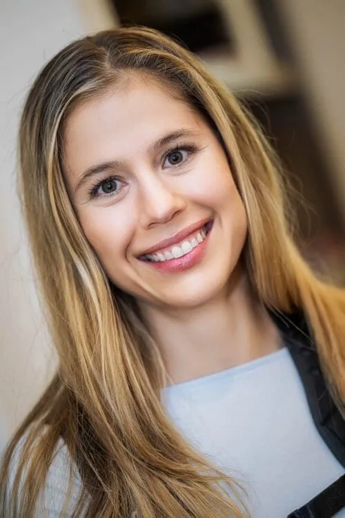 Courtney smiling in a professional portrait photography headshot.