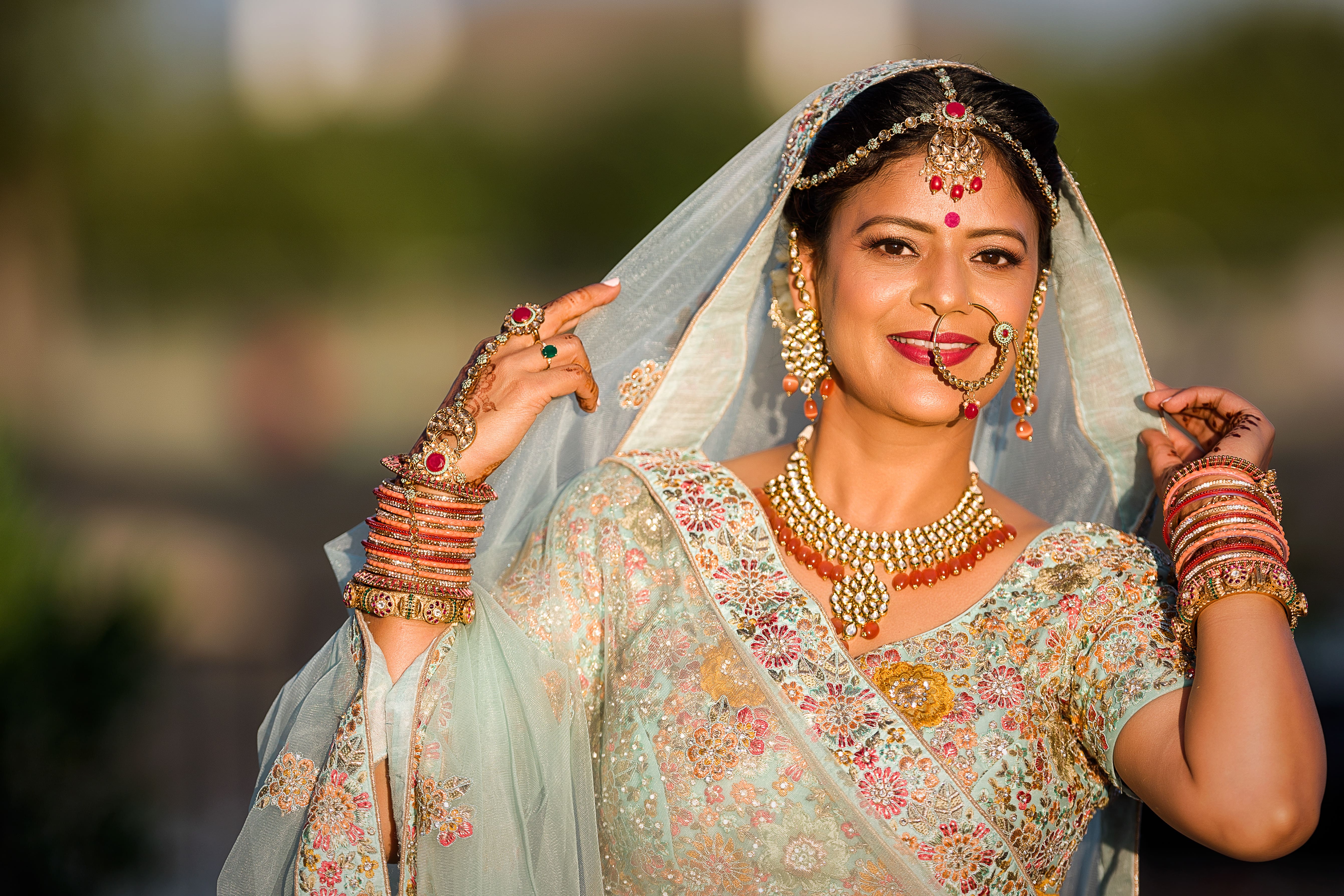 Woman dressed as bride in late afternoon sun
